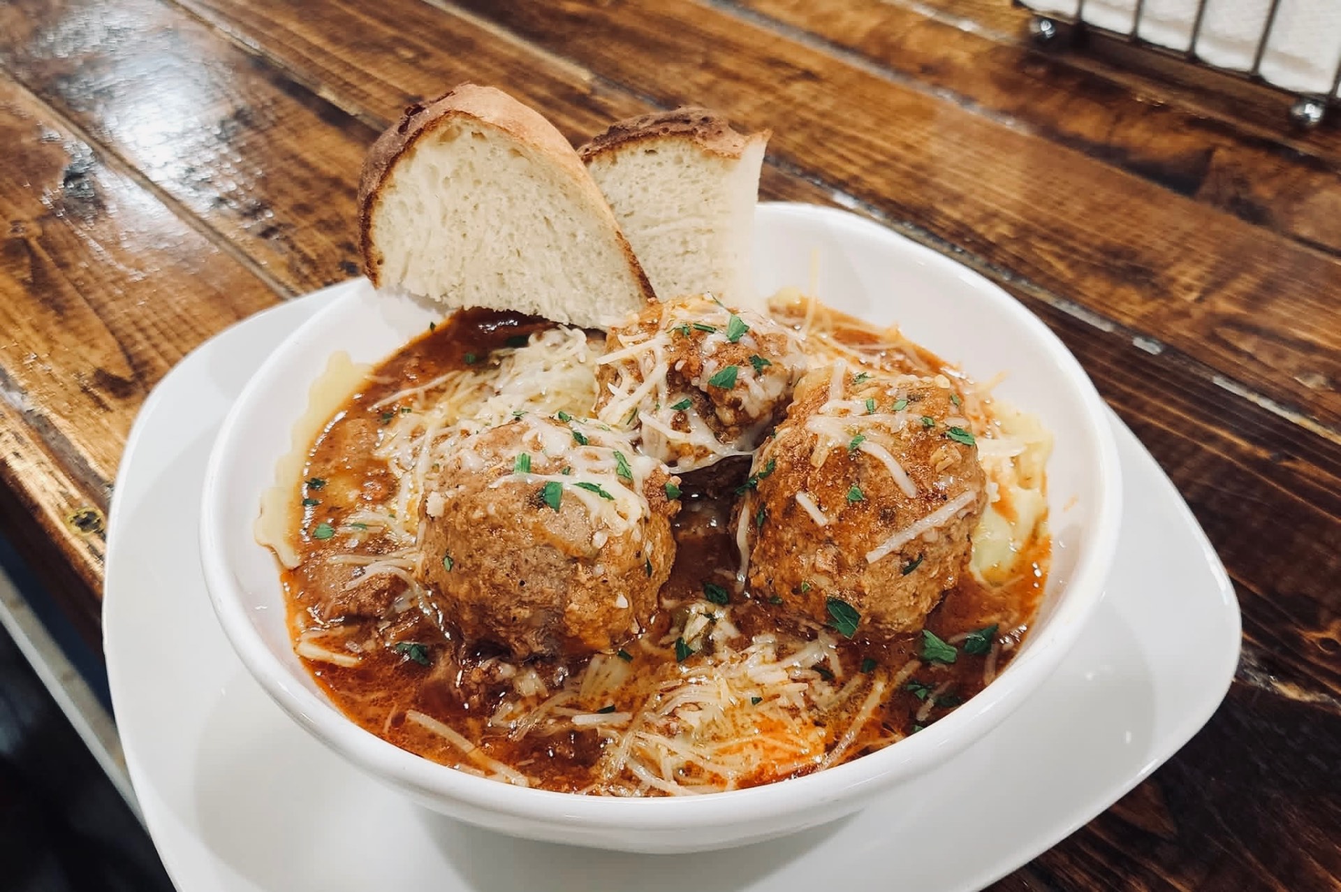 Meatballs in red sauce with parmesan and fresh bread