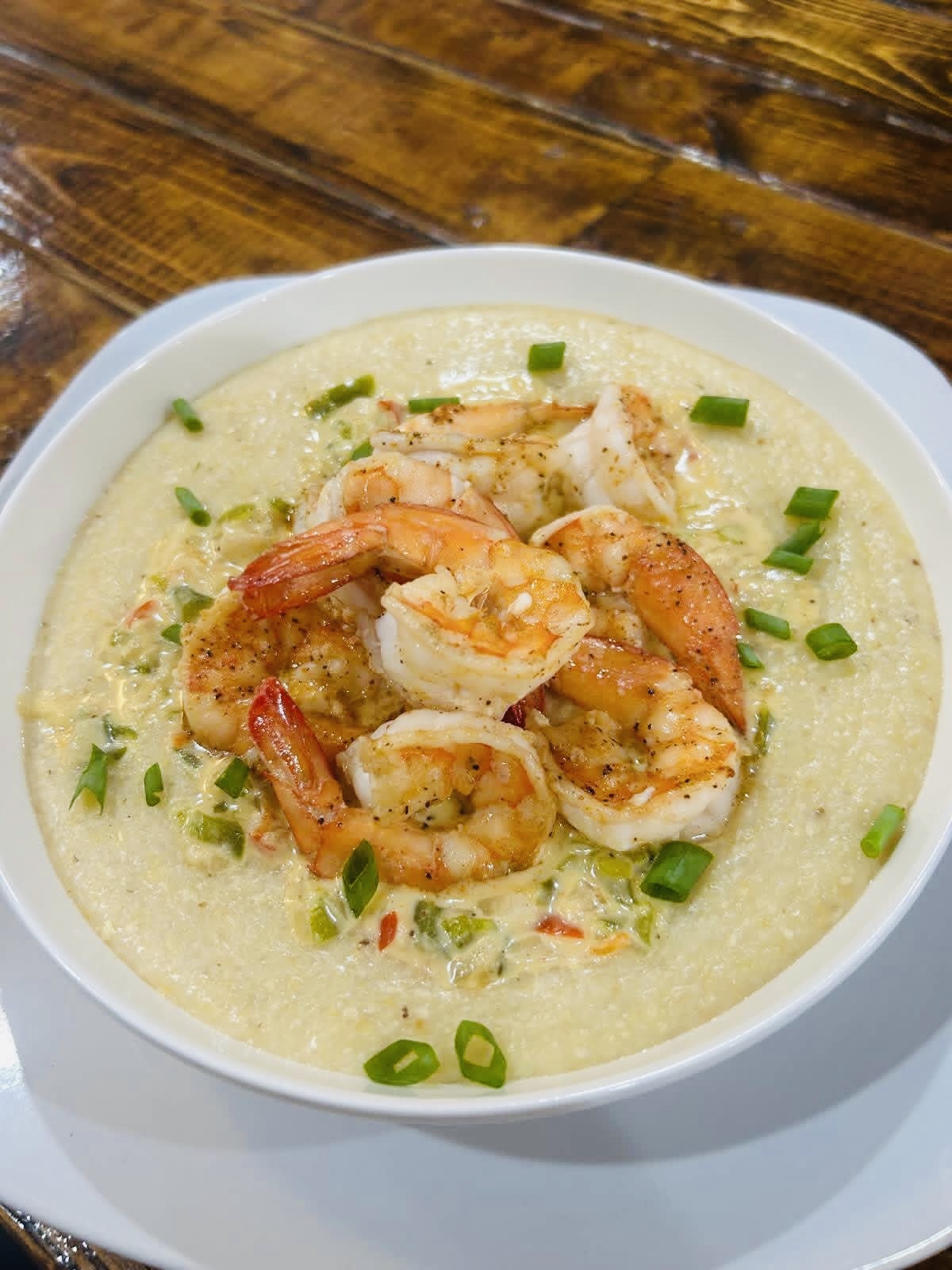 Shrimp and grits topped with green onions